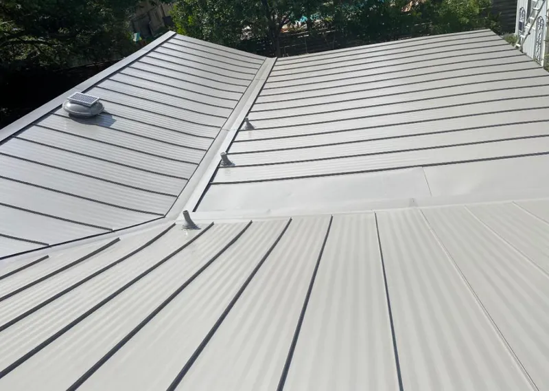 Solar attic fan installed on a metal roof for Roof Ventilation in Hurricane
